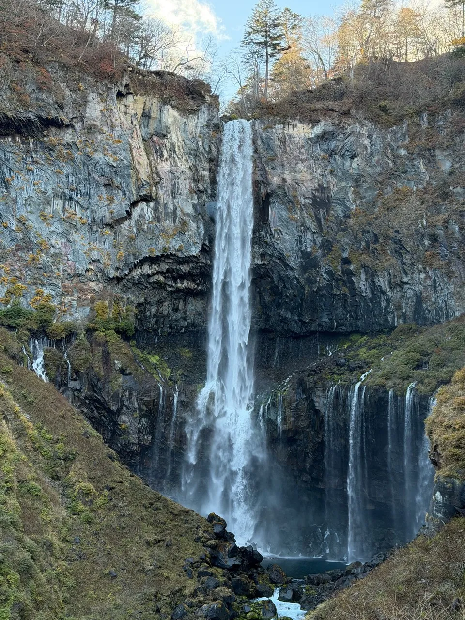 Kegon Falls, a tall single-drop waterfall over dark cliffs at Nikko