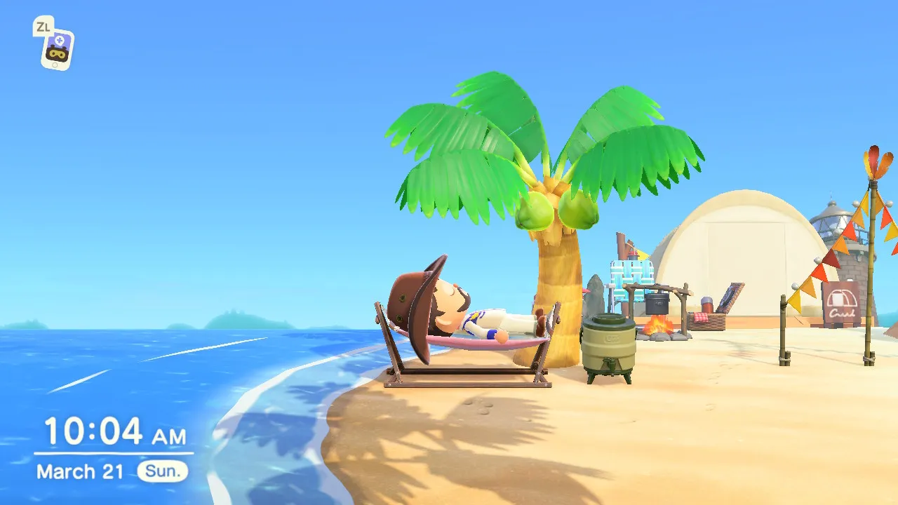One year in: Todd relaxing in a hammock under a palm on the beach.