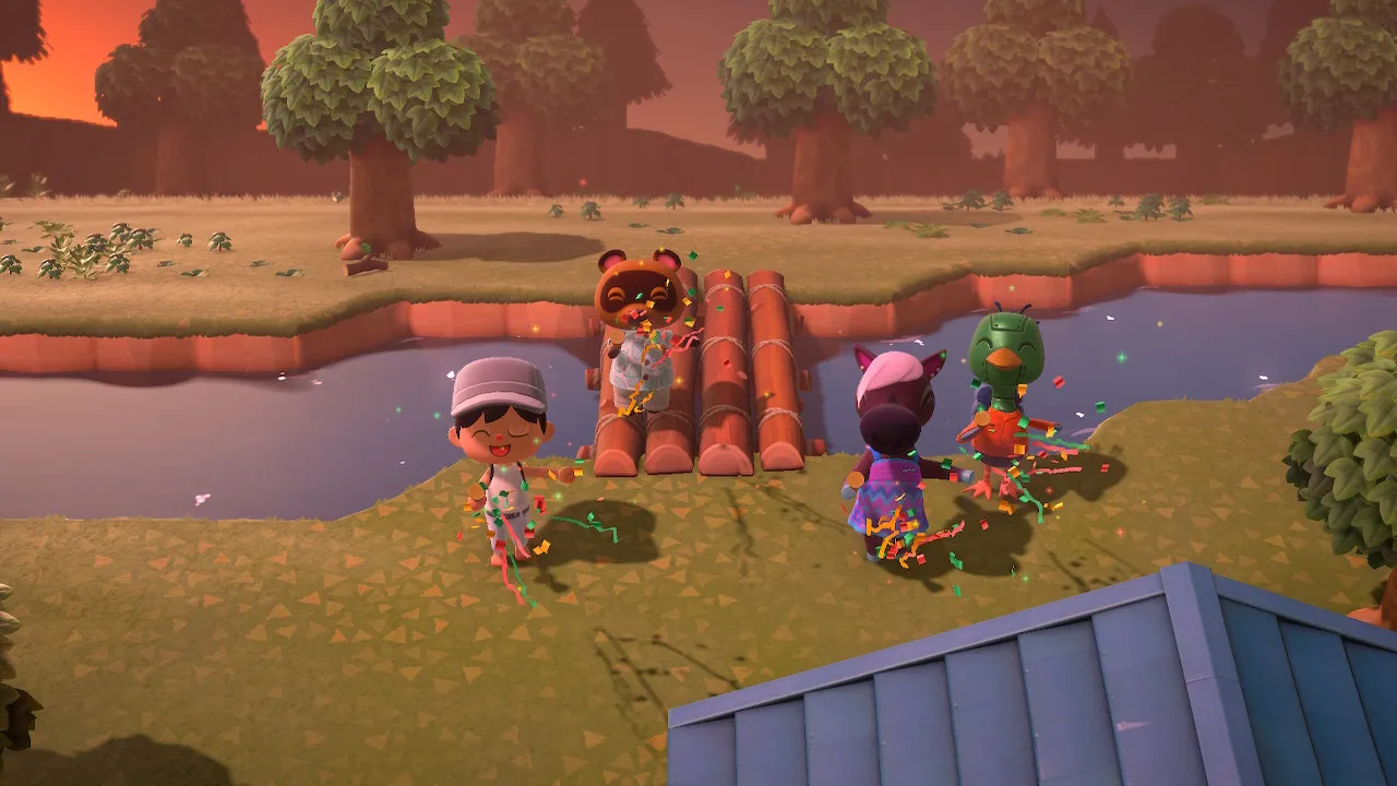 The first bridge dedication at sunset, confetti flying, Tom Nook on the logs, with my two original villagers Reneigh and Sprocket on the right.