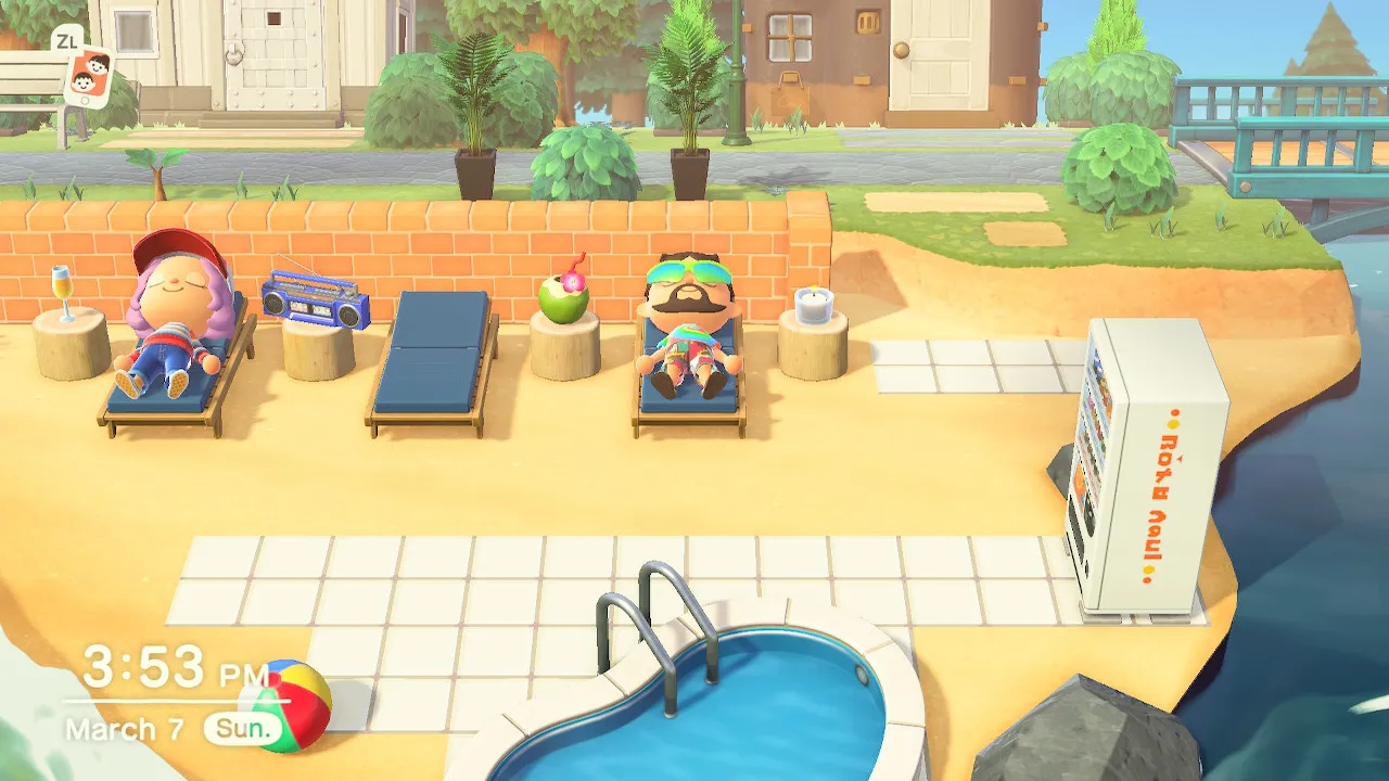 Todd and Mary lounging in beach chairs by the pool.