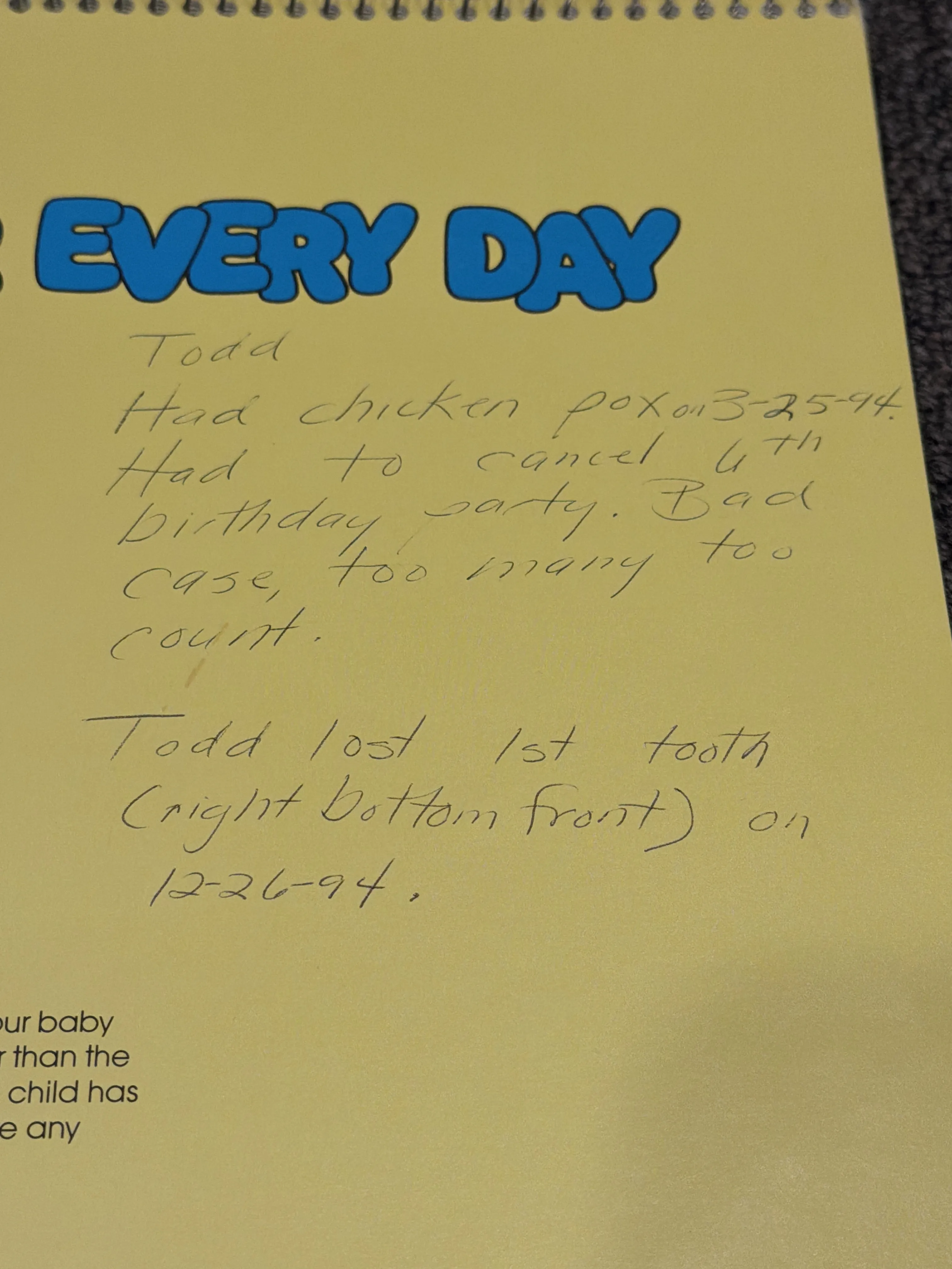 A page of my baby book titled "Every Day," with my mom's handwritten notes about my chicken pox in March 1994 and losing my first tooth in December 1994