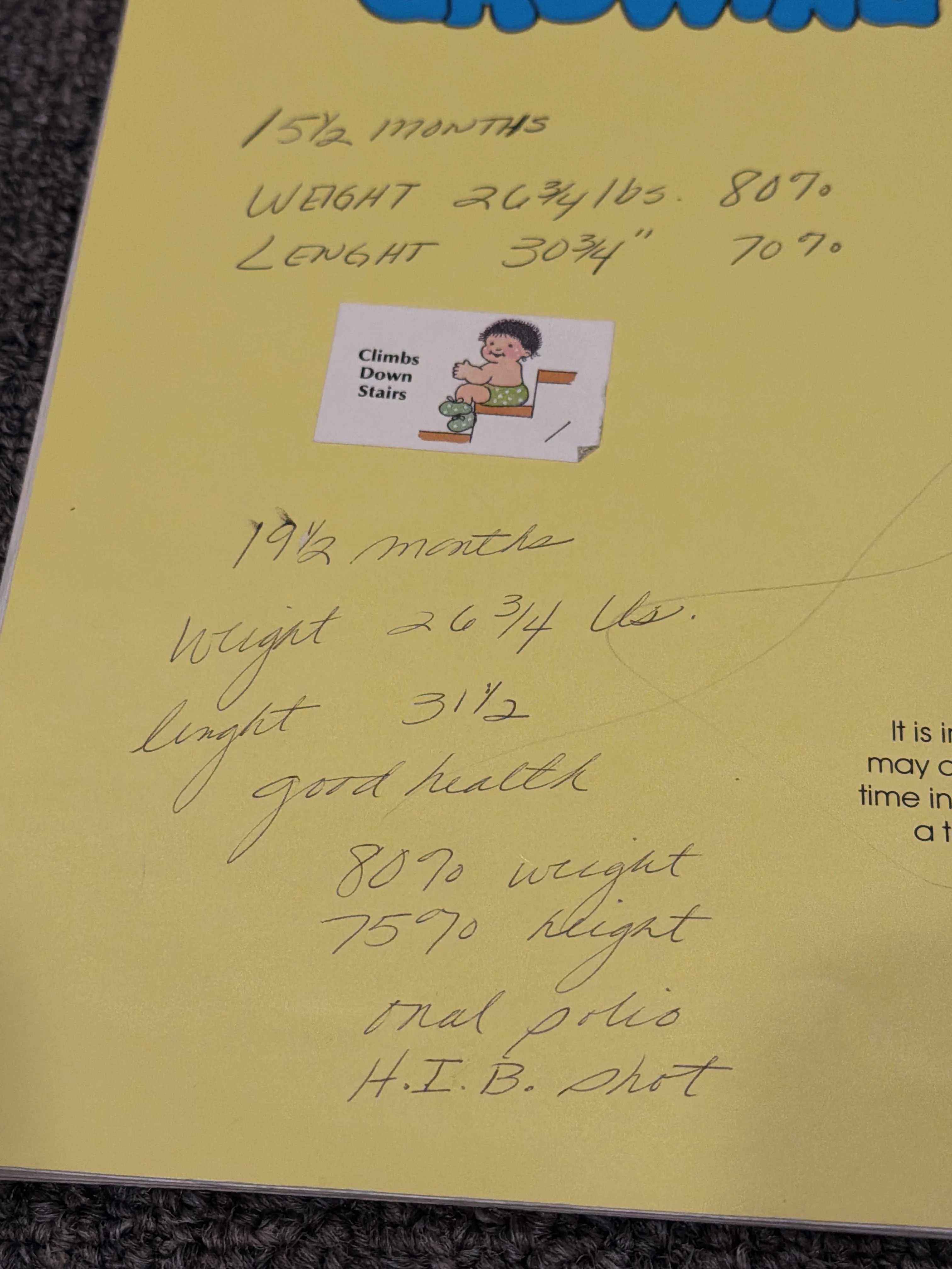 A page of my baby book titled "Growing," with handwritten height and weight measurements at fifteen and nineteen months and a "Climbs Down Stairs" sticker