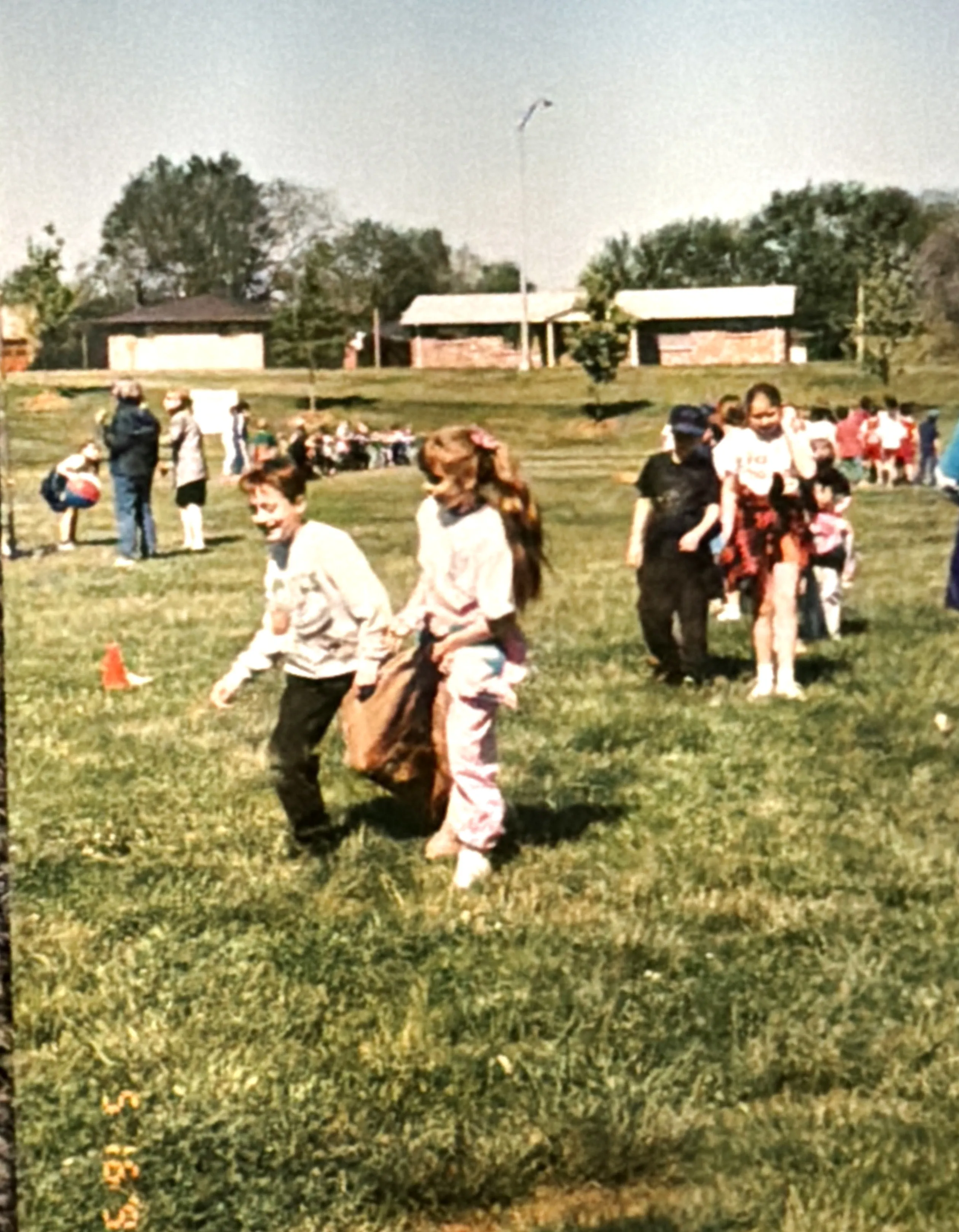 Field day, May 1997: Sara and me in the two-person sack race