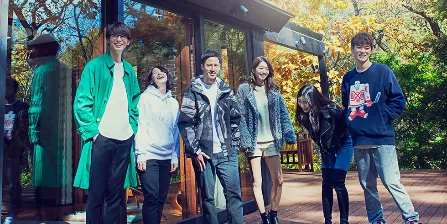The Opening New Doors cast outside the glass-walled house in snowy, autumnal Karuizawa.
