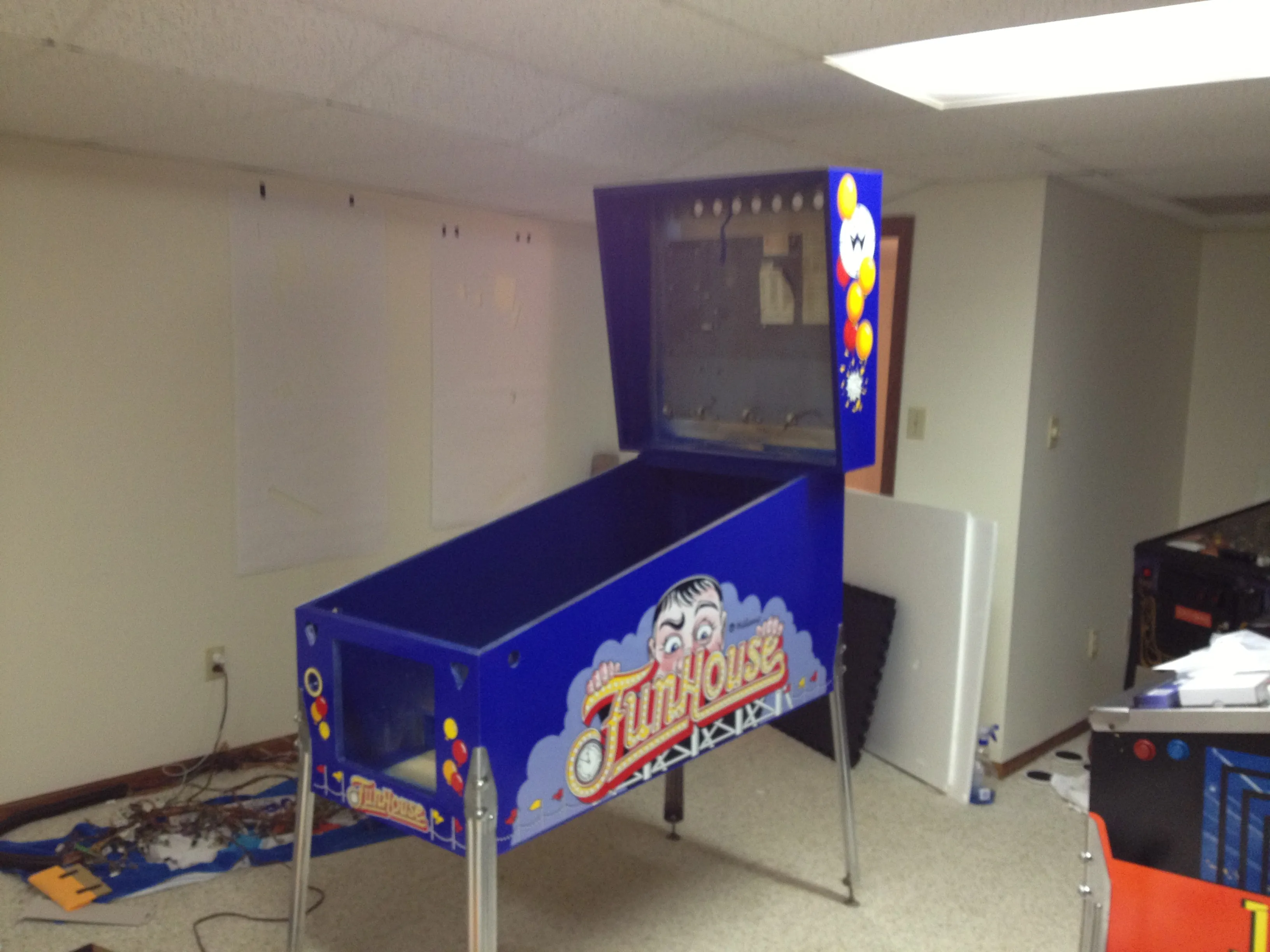 The new side art applied, looking like a brand new Funhouse in the basement