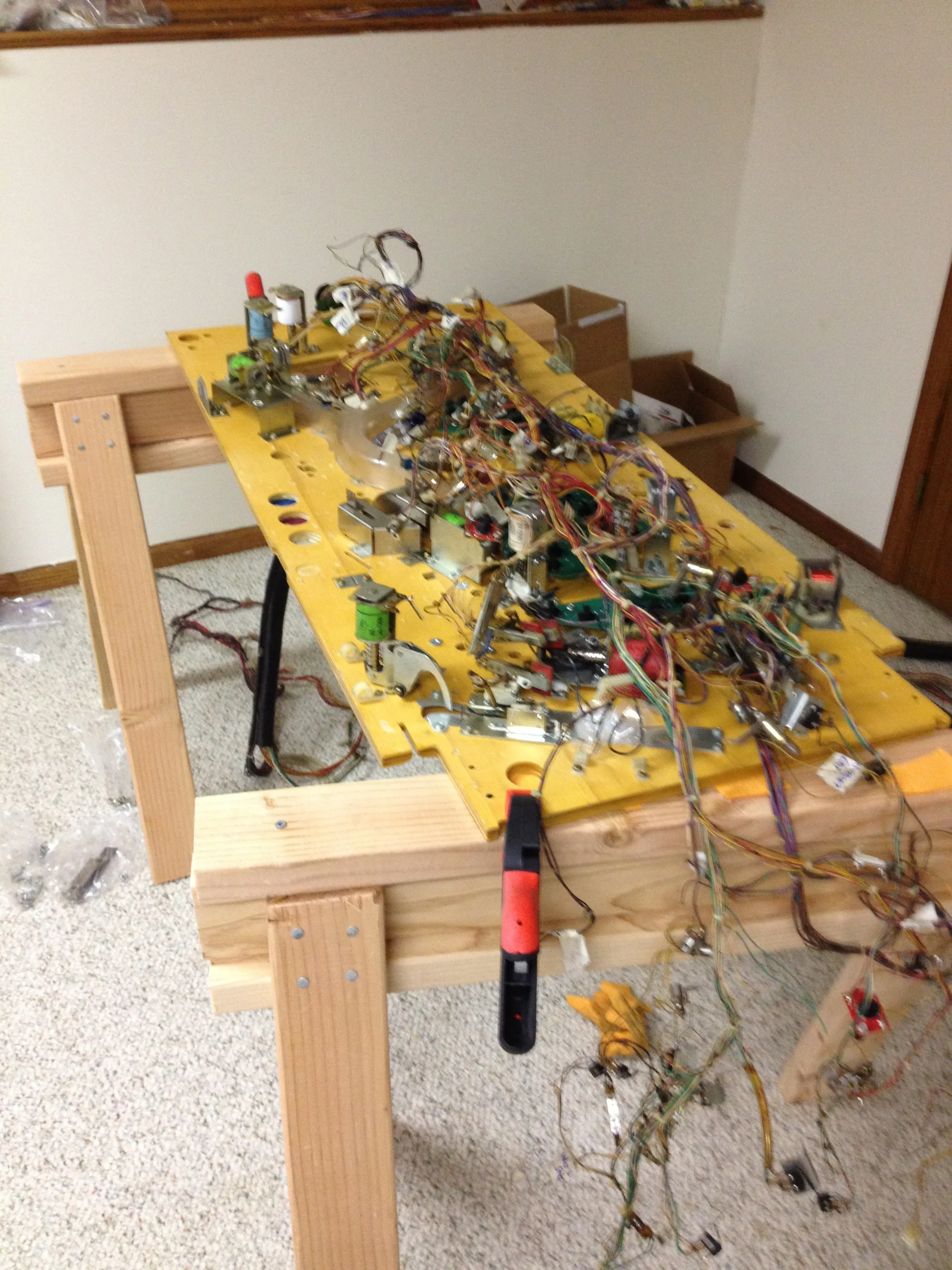 The old wiring harness going back onto the new playfield, on my homemade sawhorses