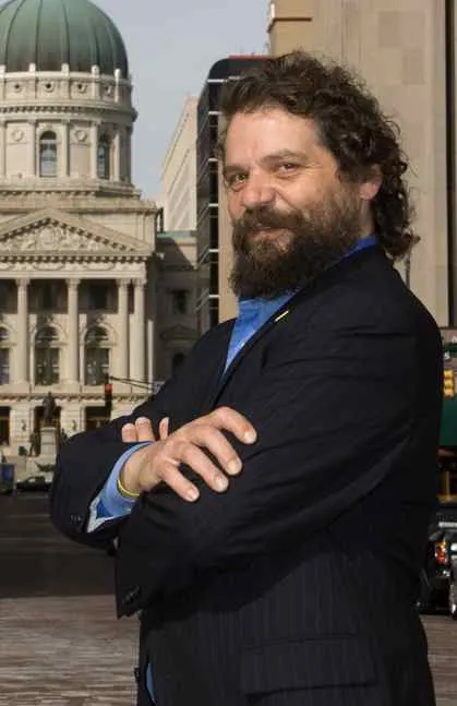 Rupert Boneham, known for his tie-dye shirts, at an event.