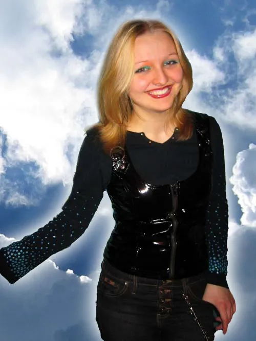Vanessa, VTM, against a sky of clouds