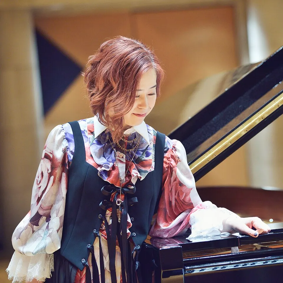 Composer Yuki Kajiura, who scored Erased.